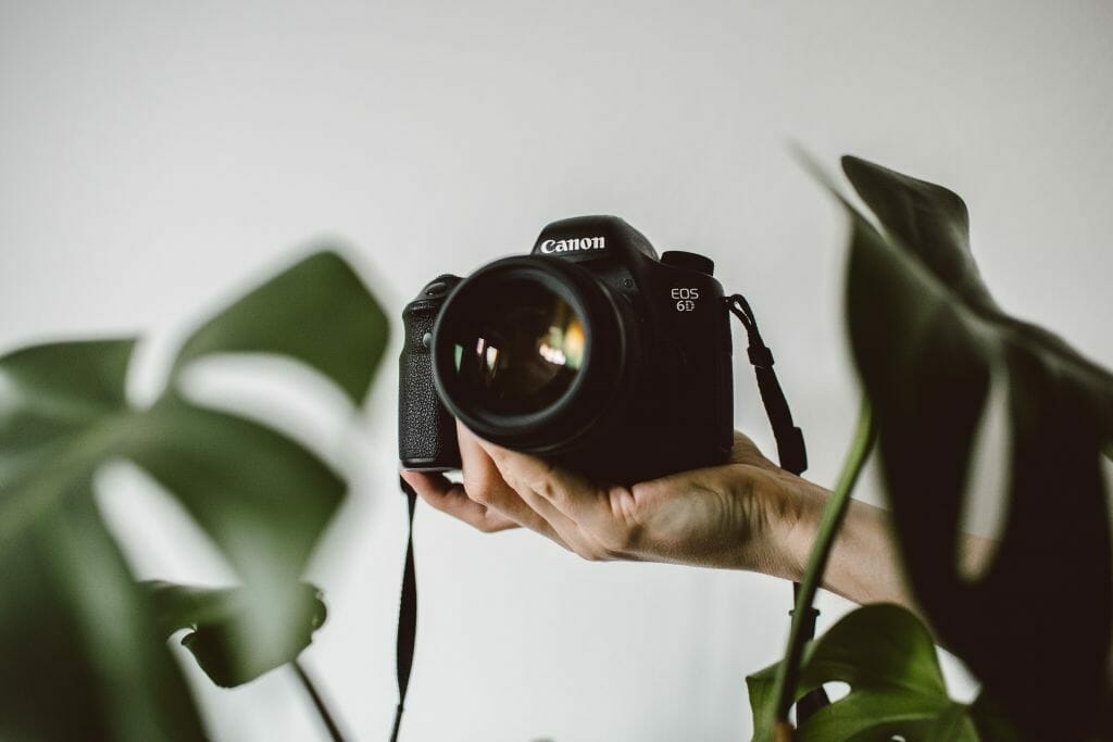 brand photography tips - camera being held by hand.